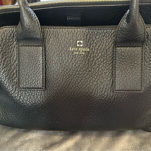 Kate Spade large hand bag. Never used. Stored in box. Purchased at outlet.